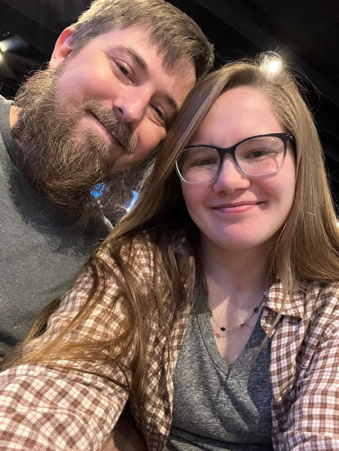 Nick and Libby smiling together in a close-up selfie